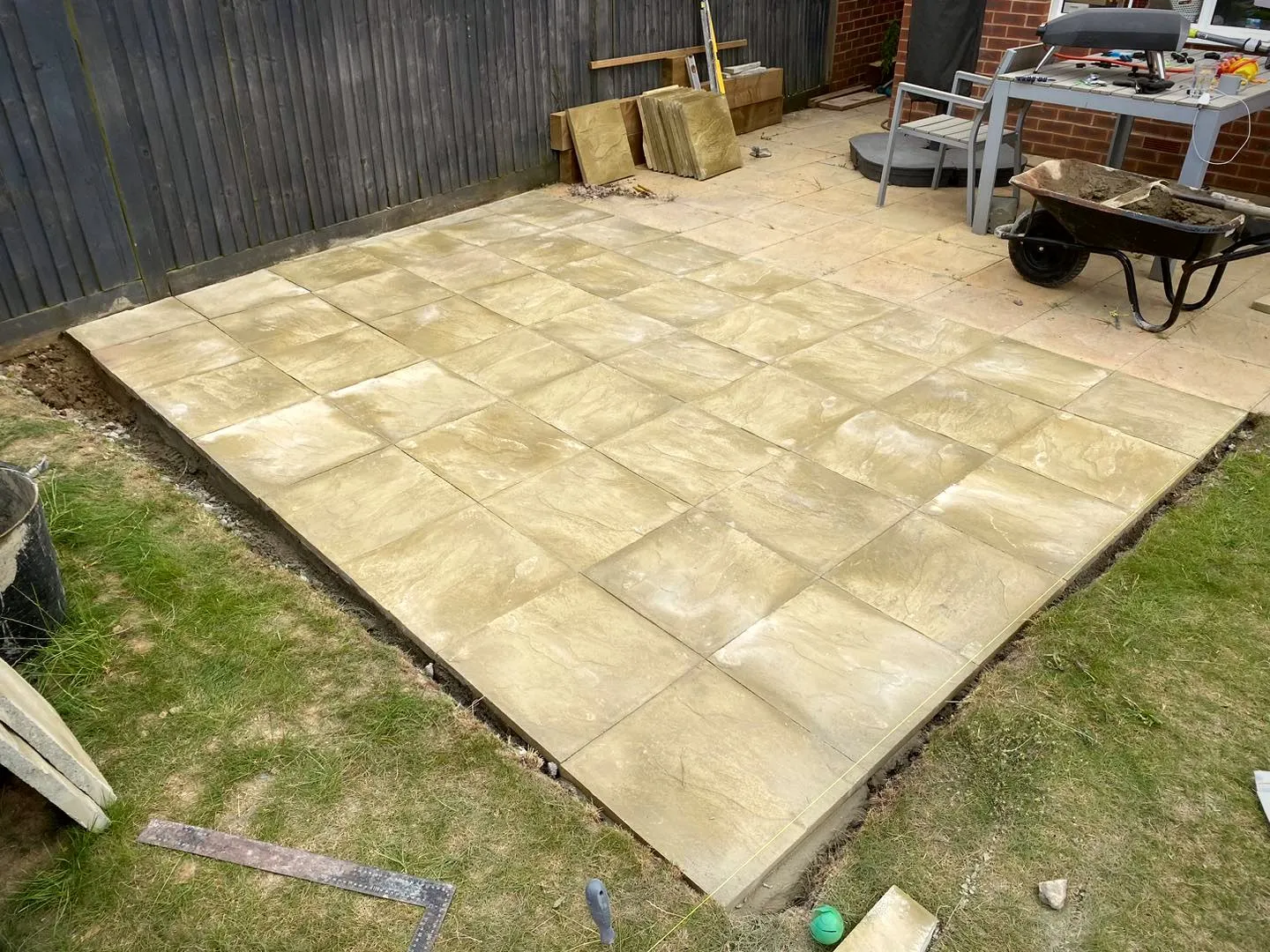 Finished garden patio in honey-toned stone